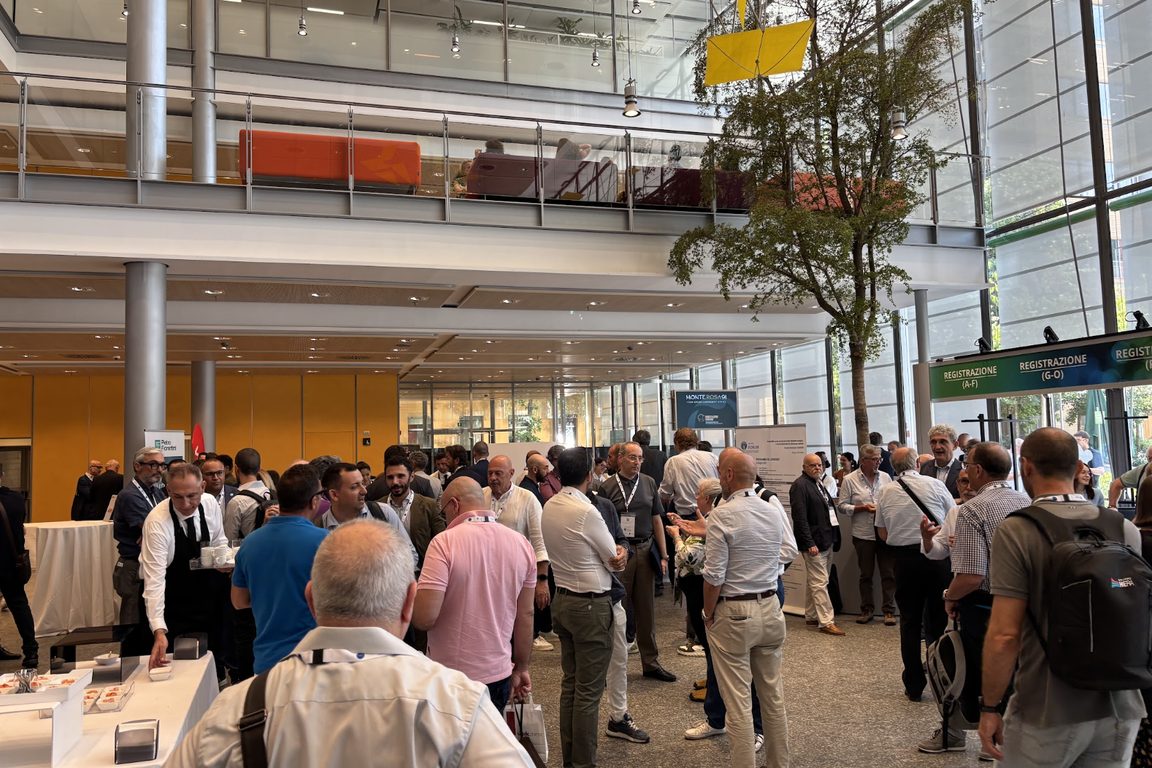 Attendees gathered in the atrium and registration area at Forum UNI-CIG 2026 in Milan